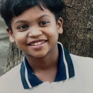 This is Tommy at age 7 the day our journey together began. Adopted from India, he and his sister, Devi,  filled my life with love, laughter, and purpose